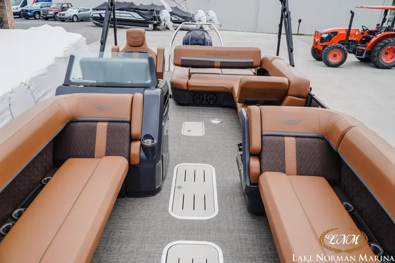 Slide: The Image of 2025 Bennington 24MSB pontoon boat with luxurious brown seating at Lake Norman Marina. - 13
