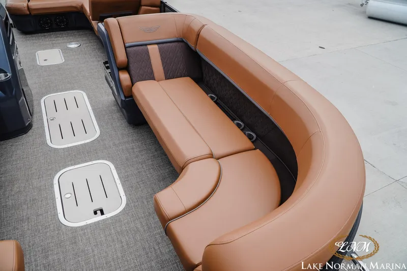 Slide: The Image of Luxurious seating on 2025 Bennington 24MSB pontoon boat with tan upholstery and spacious layout. - 16