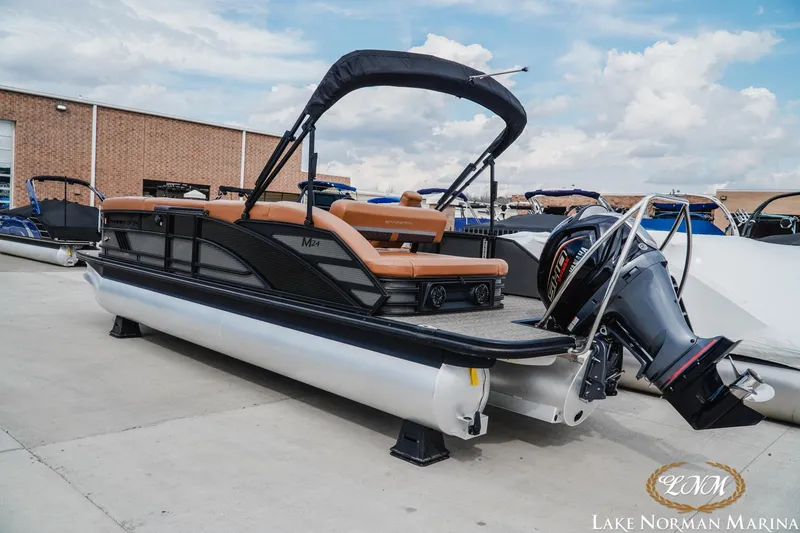 Slide: The Image of 2025 Bennington 24MSB pontoon boat with sleek design at Lake Norman Marina. - 3