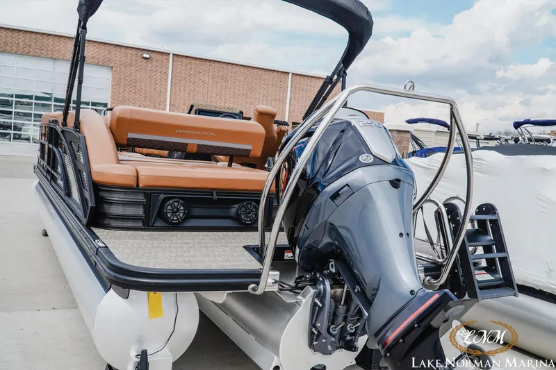 Slide: The Image of 2025 Bennington 24MSB pontoon boat with outboard motor at Lake Norman Marina. - 4
