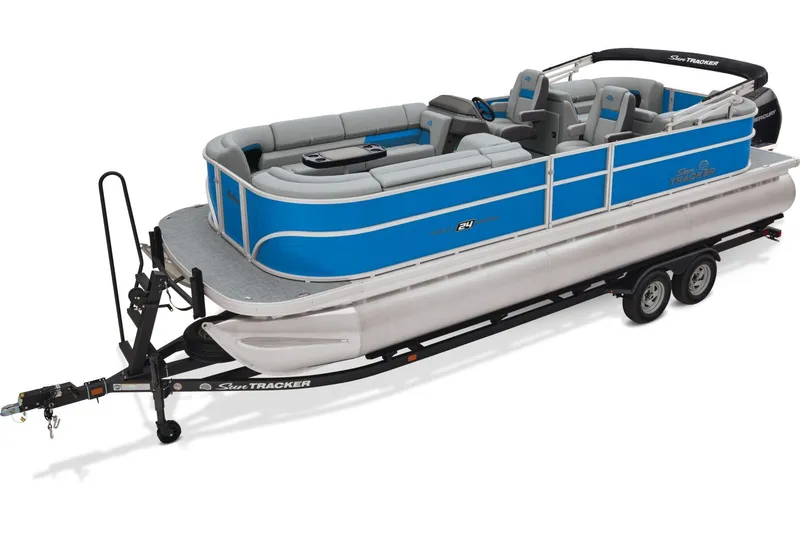 The Image of 2026 Sun Tracker Party Barge 24 XP3 pontoon boat on trailer, parked with palm trees in background. - 0
