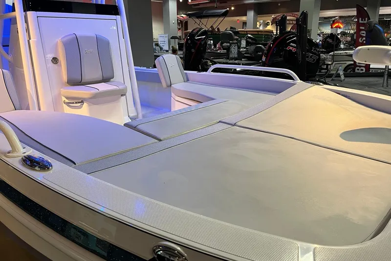 Slide: The Image of 2026 Ranger 2360 Bay boat interior with cushioned seating and modern design. - 11