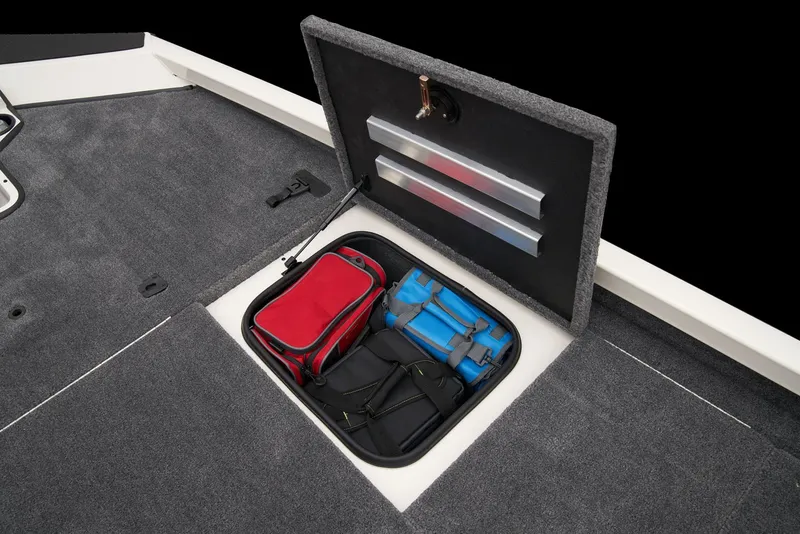 Slide: The Image of 2026 Ranger RT198P boat interior with blue and gray seating, steering console, and cup holders. - 14