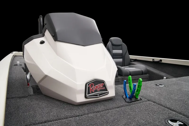 Slide: The Image of 2026 Ranger RT198P boat deck with gray carpet and blue-accented seats. - 17