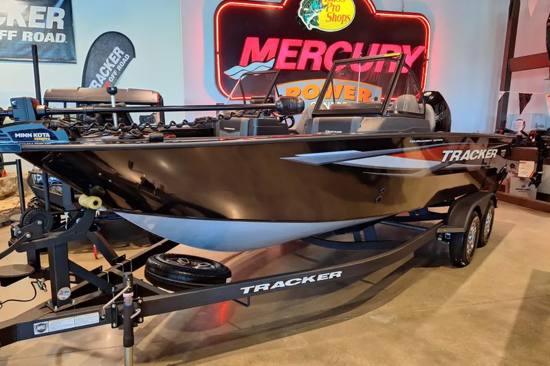 The Image of 2026 Tracker Targa V-19 Combo boat displayed indoors with Mercury signage. - 0