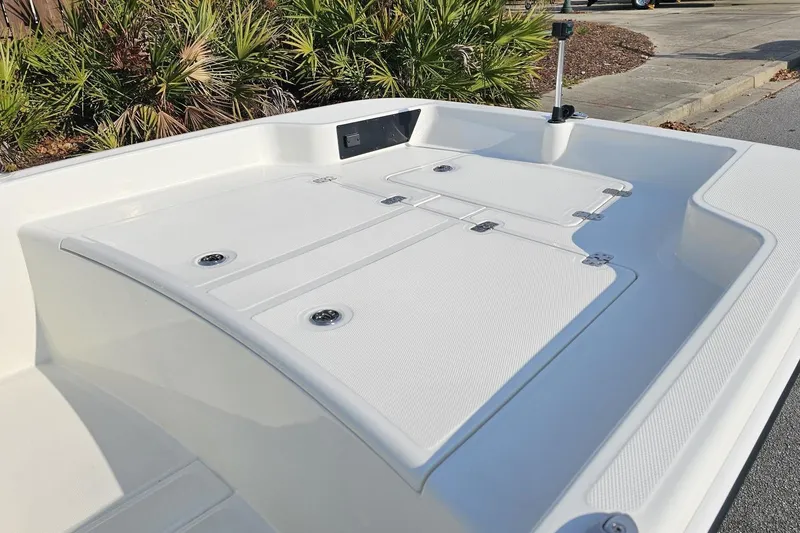 Slide: The Image of 2026 Mako Pro Skiff 15 CC boat deck with storage compartments. - 10