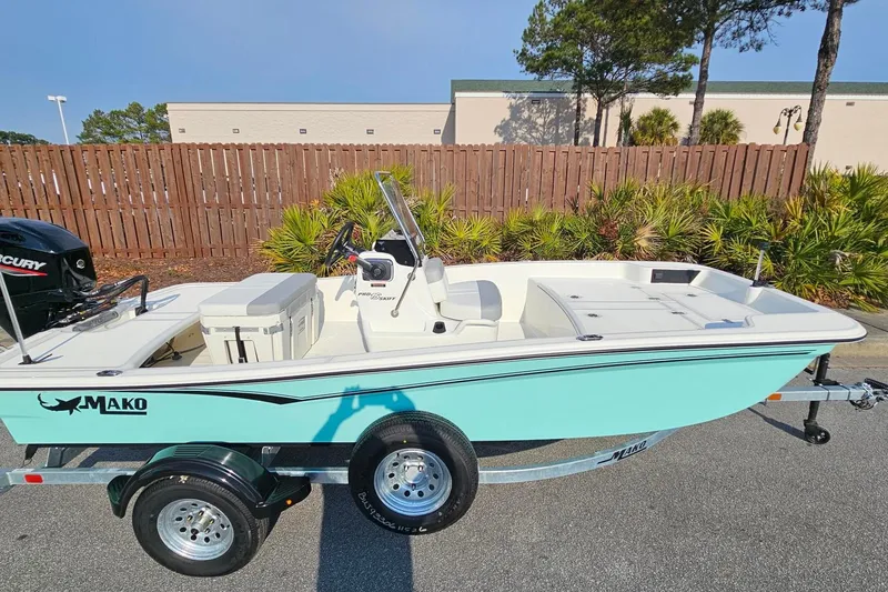 Slide: The Image of 2026 Mako Pro Skiff 15 CC boat on trailer, parked outdoors. - 3