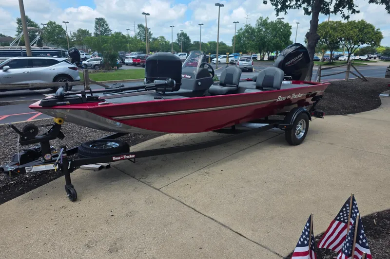 Slide: The Image of 2026 Tracker Bass Tracker Classic XL boat on display in a parking lot setting. - 3