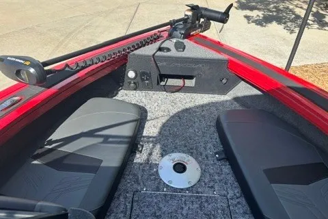 Slide: The Image of 2026 Tracker Targa V-18 Combo boat interior with red trim and seating. - 14