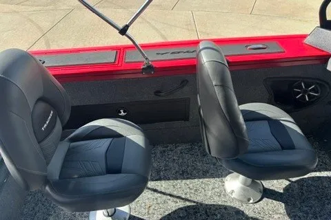 Slide: The Image of 2026 Tracker Targa V-18 Combo boat interior with two black seats and red accents. - 13