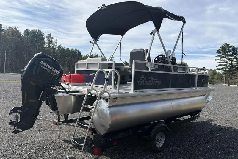 Slide: The Image of 2026 Sun Tracker Bass Buggy 16 XL Select pontoon boat with Mercury outboard motor. - 5