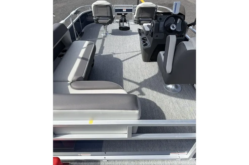 Slide: The Image of 2026 Sun Tracker Bass Buggy 16 XL Select pontoon boat interior with seating and steering console. - 9