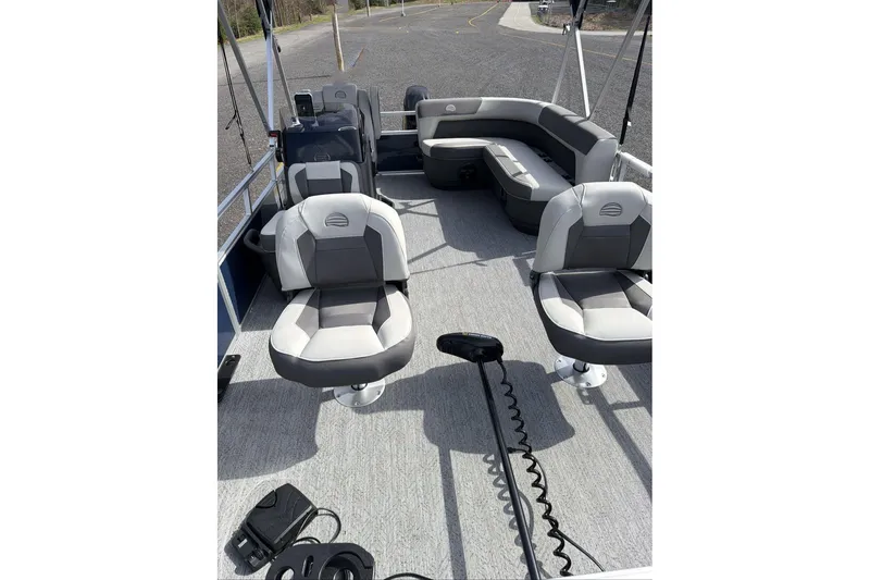Slide: The Image of 2026 Sun Tracker Bass Buggy 16 XL Select pontoon boat interior with seating and controls. - 8