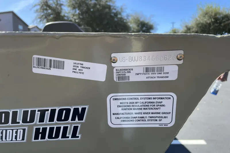 Slide: The Image of 2026 Tracker Pro Team 175 boat hull with emission control information labels. - 70