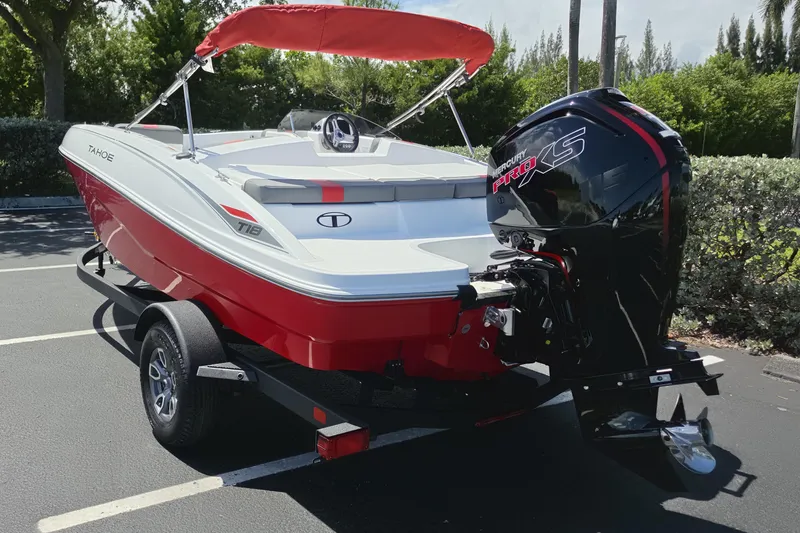 Slide: The Image of 2026 Tahoe T18 boat with red and white design, featuring a Mercury Pro XS engine. - 11