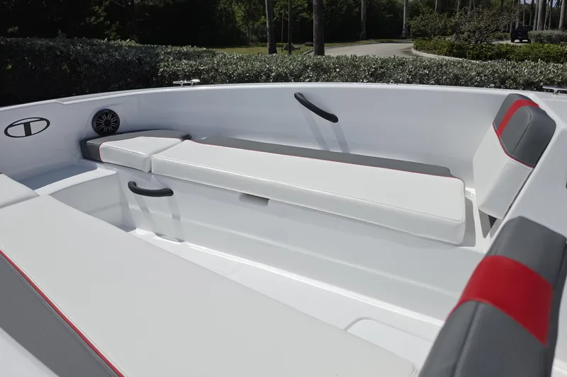 Slide: The Image of Interior of 2026 Tahoe T18 boat with white and gray seating, red accents. - 4