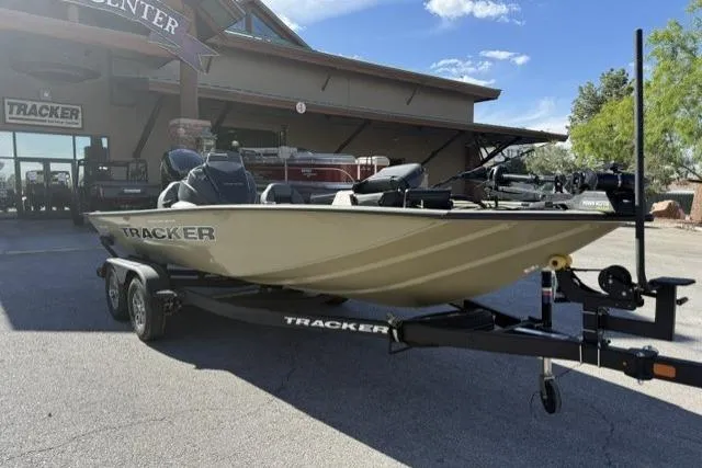 The Image of 2026 Tracker Pro Team 195 boat on trailer outside dealership. - 0