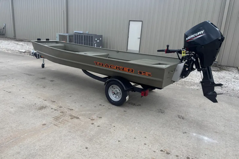 The Image of 2026 Tracker Grizzly 15 Jon boat with Mercury outboard motor on trailer. - 0