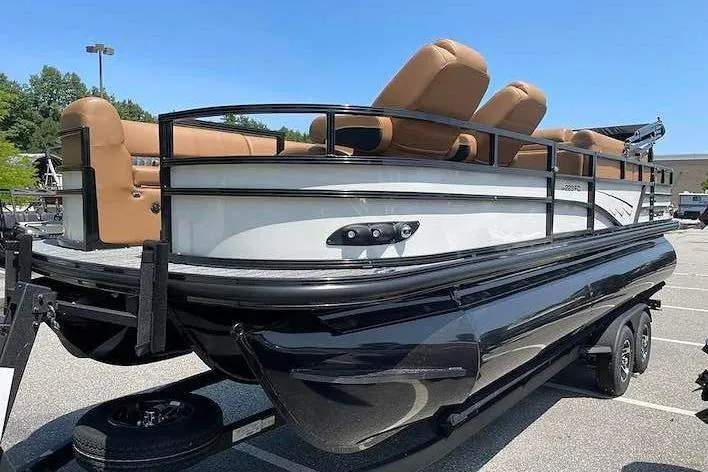 Slide: The Image of A Ranger 223FC pontoon boat with brown seats on a trailer, ready for transport. - 3