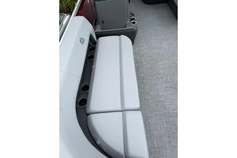 Slide: The Image of 2026 Sun Tracker Party Barge 16 DLX interior seating with cup holders. - 8