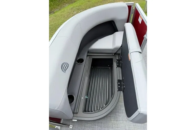 Slide: The Image of 2026 Sun Tracker Party Barge 16 DLX with open storage compartment under gray seating. - 14
