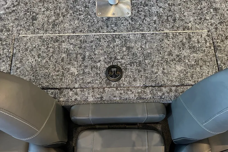 Slide: The Image of Interior of 2026 Tracker Pro Team 175 boat with gray seating and textured flooring. - 13