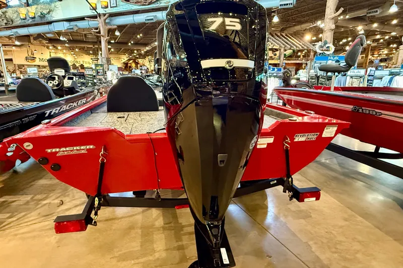 Slide: The Image of 2026 Tracker Pro Team 175 boat with 75 HP engine displayed indoors. - 19