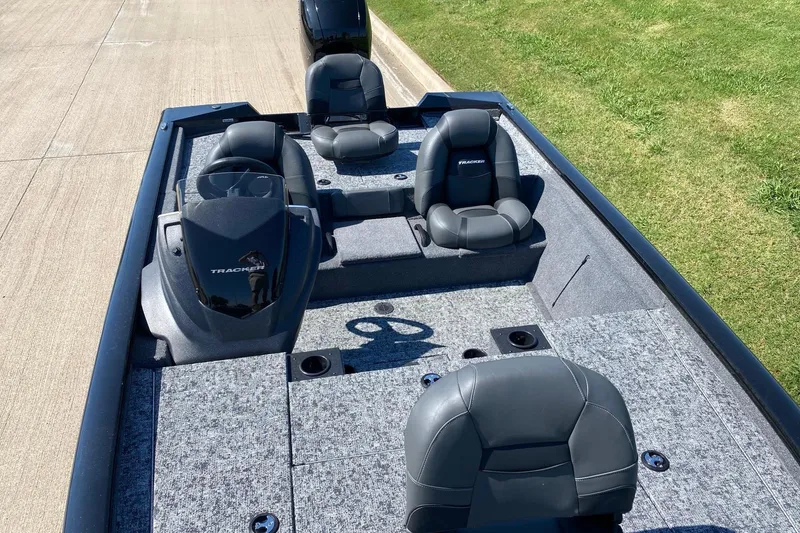 Slide: The Image of 2026 Tracker Pro Team 195 boat interior with seating and steering console. - 10
