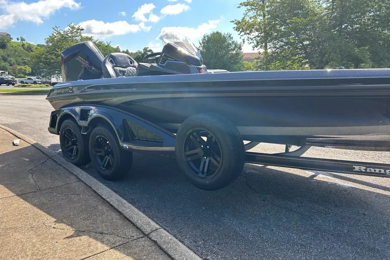 Slide: The Image of 2026 Ranger Z520R Cup-Equipped boat on trailer, parked outdoors under a sunny sky. - 4