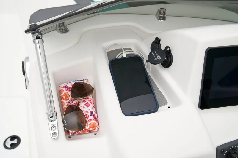 Slide: The Image of Interior seating of a 2026 Tahoe T16 boat with white and teal accents. - 15