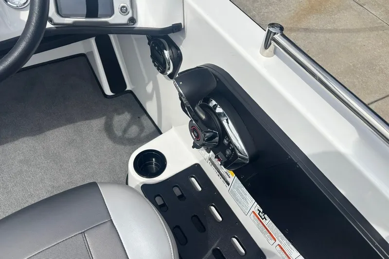 Slide: The Image of Interior of 2026 Nitro ZV19 Sport Pro boat, featuring control panel and seating. - 13