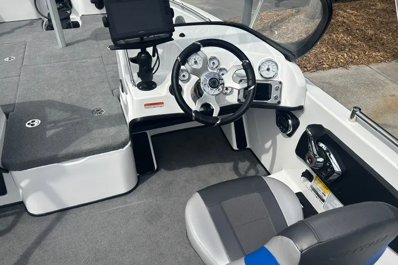 Slide: The Image of Interior of 2026 Nitro ZV19 Sport Pro boat with steering wheel and control panel. - 76