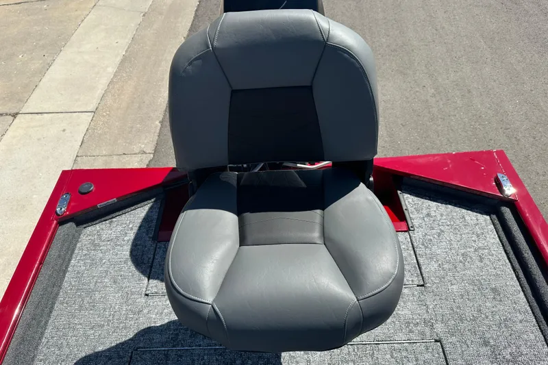 Slide: The Image of Gray seat on 2026 Tracker Pro 170 boat, red and gray deck visible. - 15