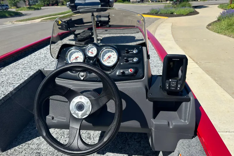 Slide: The Image of Steering console of 2026 Tracker Pro 170 boat with gauges and Garmin device. - 16
