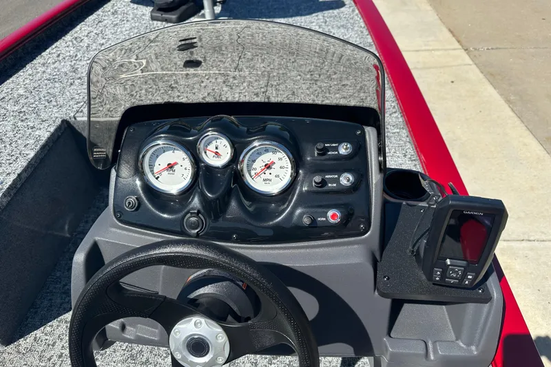 Slide: The Image of Dashboard of 2026 Tracker Pro 170 boat with gauges and Garmin device. - 17