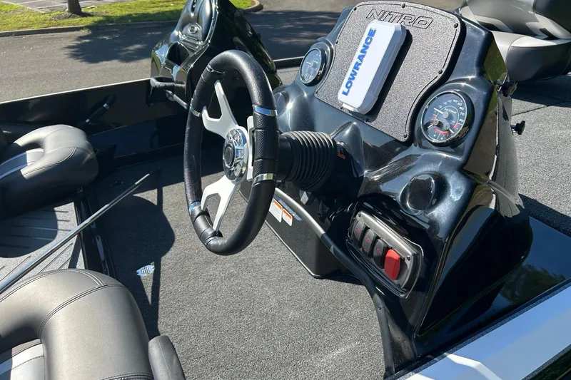 Slide: The Image of Steering console of a 2026 Nitro Z17 boat with modern controls and gauges. - 4