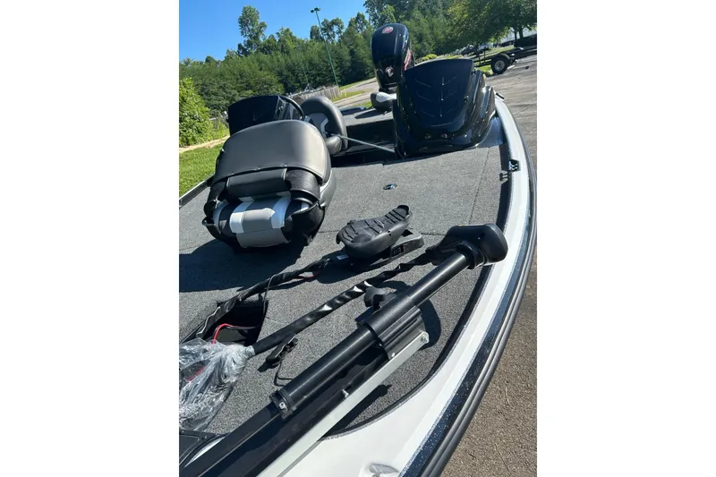 Slide: The Image of 2026 Nitro Z17 boat interior with seats and equipment on a sunny day. - 2