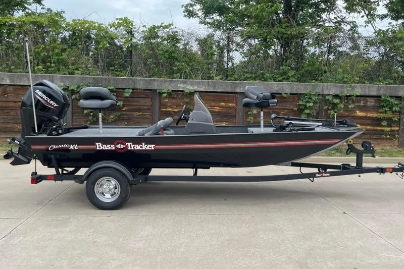 The Image of 2026 Tracker Bass Tracker Classic XL boat on trailer, parked outdoors. - 0