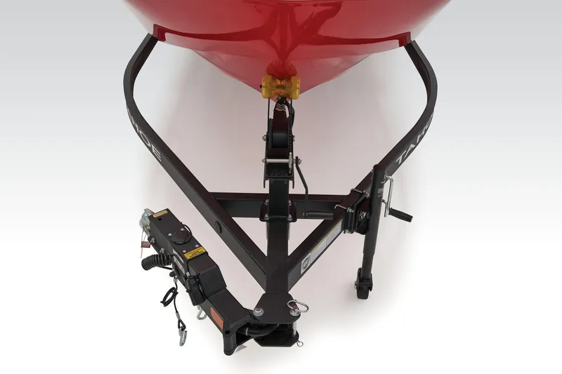 Slide: The Image of 2026 Tahoe T18 boat interior with red and gray seating, steering wheel, and canopy. - 6