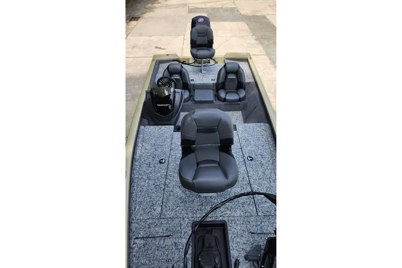 Slide: The Image of 2026 Tracker Pro Team 195 boat interior with seating and carpeted deck. - 5