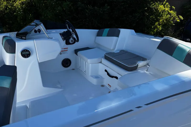 Slide: The Image of 2026 Tahoe T16 boat interior with modern seating and steering console. - 8