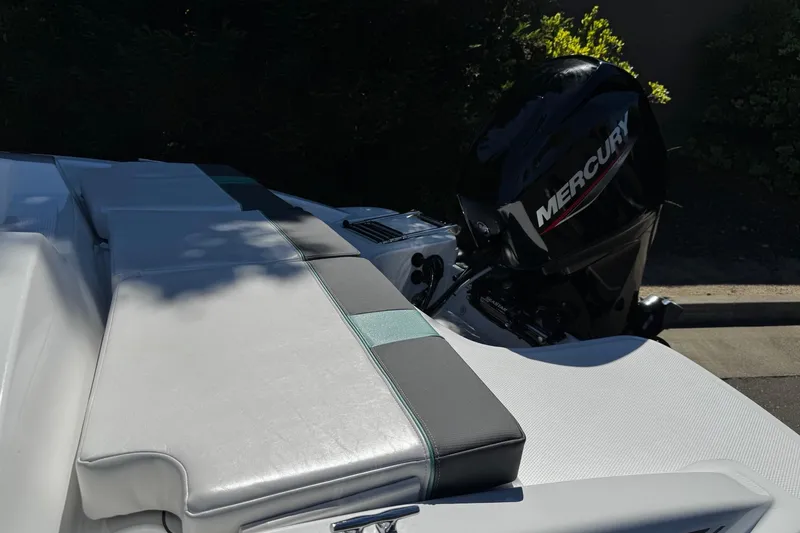Slide: The Image of 2026 Tahoe T16 boat with Mercury outboard motor, featuring sleek seating design. - 9