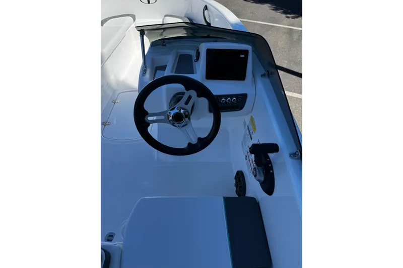 Slide: The Image of 2026 Tahoe T16 boat cockpit with steering wheel and control panel. - 6