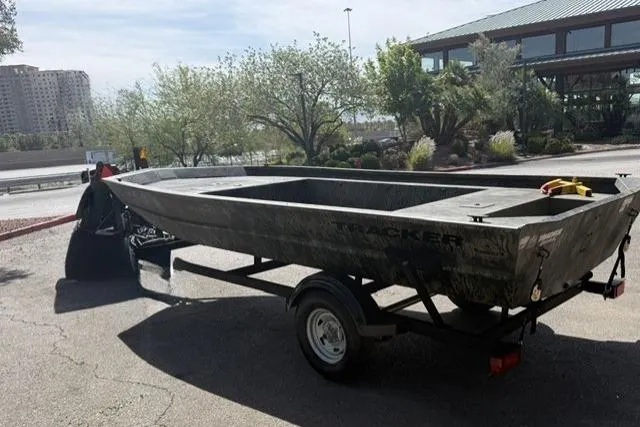 Slide: The Image of 2026 Tracker Grizzly 1754 Utility boat on trailer in outdoor setting. - 3