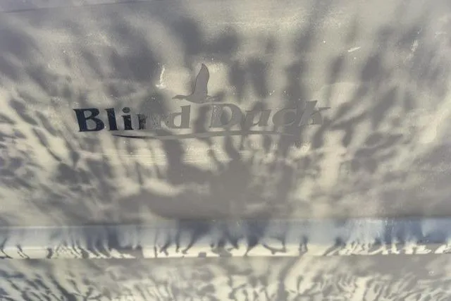 Slide: The Image of Shadowy "Blind Duck" logo on 2026 Tracker Grizzly 1754 Utility surface. - 6