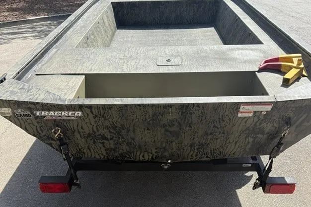 Slide: The Image of 2026 Tracker Grizzly 1754 Utility boat with camouflage design, rear view. - 7