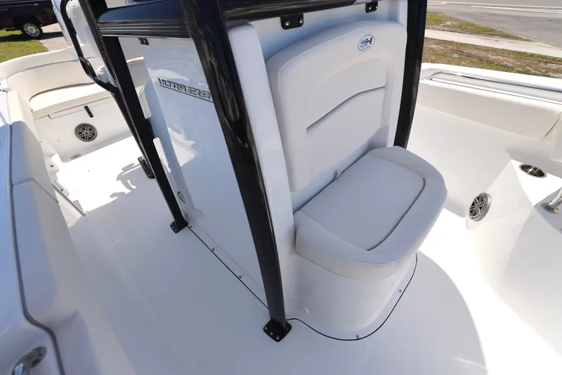 Slide: The Image of 2026 Sea Hunt Ultra 219 boat interior with seating and storage features. - 12