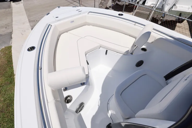 Slide: The Image of 2026 Sea Hunt Ultra 219 boat interior with white seating and stainless steel accents. - 15