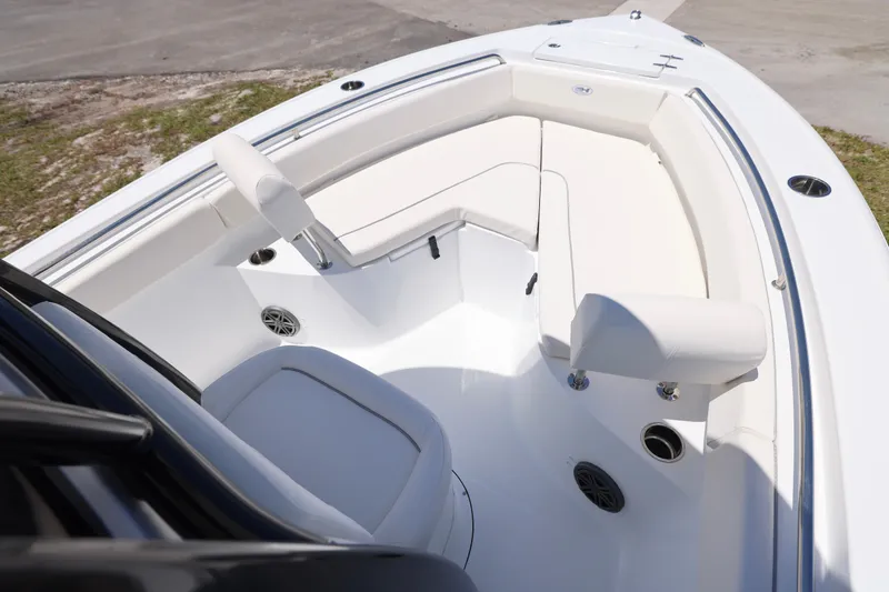 Slide: The Image of 2026 Sea Hunt Ultra 219 boat interior with white seating and modern design. - 2