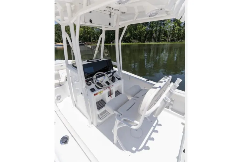 Slide: The Image of Manufacturer Provided Image: 2026 Sea Hunt Ultra 219 boat interior with helm, seats, and water view. - 24